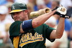MESA, AZ - MARCH 03:  Jason Giambi #16 of the Oakland Athletics warms up on deck during the spring training game against the Chicago Cubs at HoHoKam Park on March 3, 2009 in Mesa, Arizona.  The Cubs defeated the A's 6-4.  (Photo by Christian Petersen/Getty Images)