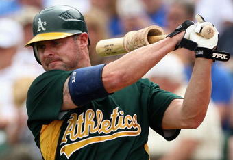 MESA, AZ - MARCH 03:  Jason Giambi #16 of the Oakland Athletics warms up on deck during the spring training game against the Chicago Cubs at HoHoKam Park on March 3, 2009 in Mesa, Arizona.  The Cubs defeated the A's 6-4.  (Photo by Christian Petersen/Getty Images)