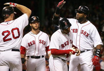 BOSTON - OCTOBER 16:  David Ortiz #34 of the Boston Red Sox is congratuled by teammates Kevin Youkilis #20, Dustin Pedroia #15 and Jed Lowrie #12 after Ortiz hit a 3 run home run against the Tampa Bay Rays in the seventh inning of game five of the American League Championship Series during the 2008 MLB playoffs at Fenway Park on October 16, 2008 in Boston, Massachusetts.  (Photo by Jim McIsaac/Getty Images)