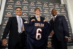 LAKE FOREST, IL - APRIL 3:  Chicago Bears general manager Jerry Angelo, quarterback Jay Cutler and head coach Lovie Smith are all smiles after introducing Cutler as their new quarterback during a press conference on April 3, 2009 at Halas Hall in Lake Forest, Illinois. (Photo by Jim Prisching/Getty Images)