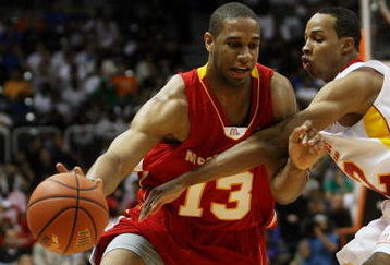 CORAL GABLES, FL - APRIL 01:  Xavier Henry #13 of the West Team drives around Dominic Cheek #32 of the East Team in the 2009 McDonald's All American Men's High School Basketball Game at BankUnited Center on April 1, 2009 in Coral Gables, Florida.  (Photo by Doug Benc/Getty Images)