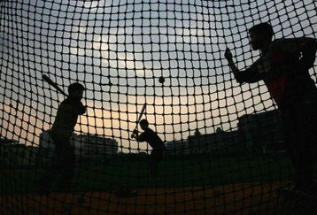 CHENGDU, CHINA - MARCH 15:  (CHINA OUT)  Children play baseball at a school at March 15, 2005 in Chengdu of Sichuan Province, China. Baseball is becoming increasingly popular in China, more and more parents, especially those of the high income rank, have sent their children to learn baseball in sports schools.  (Photo by China Photos/Getty Images)