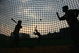 CHENGDU, CHINA - MARCH 15:  (CHINA OUT)  Children play baseball at a school at March 15, 2005 in Chengdu of Sichuan Province, China. Baseball is becoming increasingly popular in China, more and more parents, especially those of the high income rank, have sent their children to learn baseball in sports schools.  (Photo by China Photos/Getty Images)