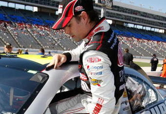 FORT WORTH, TX - APRIL 03:  Jeff Gordon, driver of the #24 DuPont Chevrolet, gets out of his car after qualifying for the NASCAR Sprint Cup Series Samsung 500 at Texas Motor Speedway on April 3, 2009 in Fort Worth, Texas.  (Photo by Jonathan Ferrey/Getty Images)