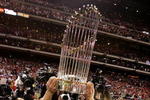 PHILADELPHIA - OCTOBER 29:  Chase Utley #26 of the Philadelphia Phillies celebrates on the field with the World Series Championship trophy after their 4-3 win against the Tampa Bay Rays during the continuation of game five of the 2008 MLB World Series on October 29, 2008 at Citizens Bank Park in Philadelphia, Pennsylvania.  (Photo by Doug Pensinger/Getty Images)