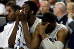 DETROIT - APRIL 04:  (L-R) Hasheem Thabeet #34 and Jeff Adrien #4 of the Connecticut Huskies covers his face in the second half against the Michigan State Spartans during the National Semifinal game of the NCAA Division I Men's Basketball Championship at Ford Field on April 4, 2009 in Detroit, Michigan. The Spartans defeated the Huskies 82-73.  (Photo by Andy Lyons/Getty Images)