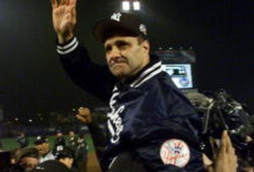 26 Oct 2000:  Manager Joe Torre of the New York Yankees celebrates their 4-2 win over the New York Mets to win their third consecutive World Series Championship at Shea Stadium in Flushing, New York. <DIGITAL IMAGE> Mandatory Credit: Jed Jacobsohn/ALLSPORT