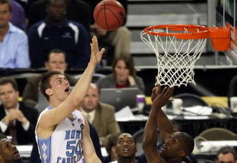 DETROIT - APRIL 04:  Tyler Hansbrough #50 of the North Carolina Tar Heels goes up for a shot over Dante Cunningham #33 of the Villanova Wildcats in the first half during the National Semifinal game of the NCAA Division I Men's Basketball Championship at Ford Field on April 4, 2009 in Detroit, Michigan.  (Photo by Gregory Shamus/Getty Images)