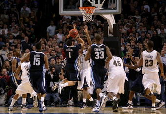 BOSTON - MARCH 28:  Scottie Reynolds #1 of the Villanova Wildcats puts up the game-winning shot against the Pittsburgh Panthersduring the NCAA Men's Basketball Tournament East Regionals at TD Banknorth Garden on March 28, 2009 in Boston, Massachusetts.  (Photo by Elsa/Getty Images)