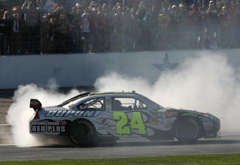 FORT WORTH, TX - APRIL 05:  Jeff Gordon, driver of the #24 DuPont Chevrolet, does a victory burnout after winning the NASCAR Sprint Cup Series Samsung 500 at Texas Motor Speedway on April 5, 2009 in Fort Worth, Texas.  (Photo by Tom Pennington/Getty Images for NASCAR)