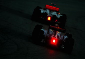 KUALA LUMPUR, MALAYSIA - APRIL 05:  Lewis Hamilton of Great Britain and McLaren Mercedes leads Mark Webber of Australia and Red Bull Racing as they drive in heavy rain during the Malaysian Formula One Grand Prix at the Sepang Circuit on April 5, 2009 in Kuala Lumpur, Malaysia.  (Photo by Clive Mason/Getty Images)
