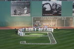 BOSTON - JULY 22:  Former teammates and current Boston Red Sox players stand around a '9' in left field during the Ted Williams tribute on July 22, 2002 at Fenway Park in Boston, Massachusetts. The public was invited to the park to honor Williams who died July 5, 2002.  (Photo by Darren McCollester/Getty Images)  