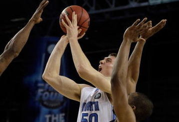 DETROIT - APRIL 04:  Tyler Hansbrough #50 of the North Carolina Tar Heels shoots the ball over Dwayne Anderson #22 of the Villanova Wildcats during the National Semifinal game of the NCAA Division I Men's Basketball Championship at Ford Field on April 4, 2009 in Detroit, Michigan.  (Photo by Andy Lyons/Getty Images)