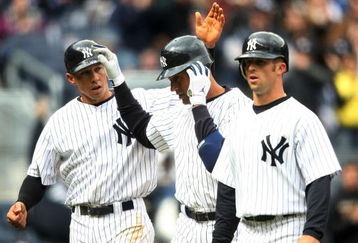 NEW YORK - APRIL 04: Derek Jeter #2 of the New York Yankees celebrates hitting his three run home run with teammates Cody Ransom #12 and  Brett Gardner #11 against the Chicago Cubs during their game on April 4, 2009 at Yankee Stadium in the Bronx borough of New York City.  (Photo by Nick Laham/Getty Images)