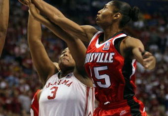 ST. LOUIS - APRIL 05:  Angel MCoughtry #35 of the Louisville Cardinals and Courtney Paris #3 of the Oklahoma Sooners fight for the rebound  during the Womens Final Four Semifinals at the Scottrade Center on April 5, 2009 in St. Louis, Missouri.  (Photo by Elsa/Getty Images)