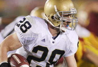 LOS ANGELES - NOVEMBER 29:  Kyle McCarthy #28 of the Notre Dame Fighting Irish returns an interception eight yards out of the endzone against the USC Trojans in the third quarter on November 29, 2008 at the Los Angeles Memorial Coliseum in Los Angeles, California.  USC won 38-3.  (Photo by Jeff Golden/Getty Images) 