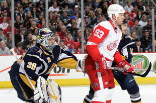 BUFFALO, NY - MARCH 2:  Goaltender Ryan Miller #30 of the Buffalo Sabres tries to get a look at the puck around the screen of Johan Franzen #93 of the Detroit Red Wings during their NHL game on March 2, 2008 at HSBC Arena in Buffalo, New York. The Red Wings defeated the Sabres 4-2. (Photo by Rick Stewart/Getty Images)