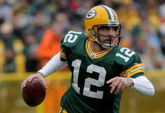 GREEN BAY, WI - NOVEMBER 16:  Quaterback Aaron Rodgers #12 of the Green Bay Packers looks for a receiver against the Chicago Bears during the NFL game at Lambeau Field on November 16, 2008 in Green Bay, Wisconsin.  (Photo by Doug Pensinger/Getty Images)