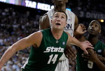 DETROIT - APRIL 04:  Goran Suton #14 and Travis Walton #5 of the Michigan State Spartans box out Hasheem Thabeet #34 of the Connecticut Huskies in the second half during the National Semifinal game of the NCAA Division I Men's Basketball Championship at Ford Field on April 4, 2009 in Detroit, Michigan.  (Photo by Andy Lyons/Getty Images)