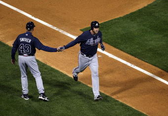 PHILADELPHIA - APRIL 05:  Brian McCann #16 of the Atlanta Braves is congratulated by third base coach Brian Snitker after McCann hit a two-run home run in the first inning of their game against the Philadelphia Phillies on April 5, 2009 at Citizens Bank Park in Philadelphia, Pennsylvania. Today's game is the opening of the 2009 major league baseball season.  (Photo by Ezra Shaw/Getty Images)