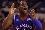 INDIANAPOLIS - MARCH 27:  Sherron Collins #4 of the Kansas Jayhawks reacts in the first half against the Michigan State Spartans during the third round of the NCAA Division I Men's Basketball Tournament at the Lucas Oil Stadium on March 27, 2009 in Indianapolis, Indiana.  (Photo by Andy Lyons/Getty Images)