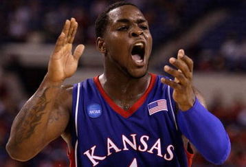 INDIANAPOLIS - MARCH 27:  Sherron Collins #4 of the Kansas Jayhawks reacts in the first half against the Michigan State Spartans during the third round of the NCAA Division I Men's Basketball Tournament at the Lucas Oil Stadium on March 27, 2009 in Indianapolis, Indiana.  (Photo by Andy Lyons/Getty Images)