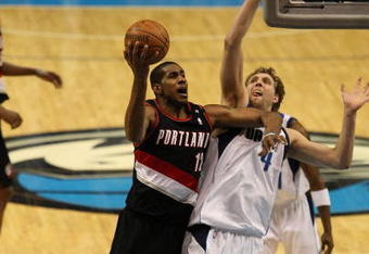 DALLAS - FEBRUARY 04: LaMarcus Aldridge #12 of the Portland Trail Blazers takes a shot against Dirk Nowitzki #21 of the Dallas Mavericks on February 4, 2009 at American Airlines Center in Dallas, Texas.  NOTE TO USER: User expressly acknowledges and agrees that, by downloading and/or using this Photograph, user is consenting to the terms and conditions of the Getty Images License Agreement.  (Photo by Ronald Martinez/Getty Images)