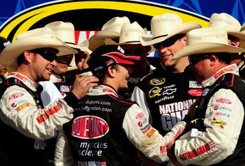 FORT WORTH, TX - APRIL 05:  Jeff Gordon (C), driver of the #24 DuPont Chevrolet, talks with his crew in victory lane after winning the NASCAR Sprint Cup Series Samsung 500 at Texas Motor Speedway on April 5, 2009 in Fort Worth, Texas.  (Photo by Rusty Jarrett/Getty Images for NASCAR)