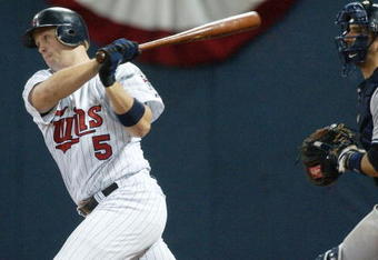 MINNEAPOLIS - OCTOBER 8:  Third baseman Michael Cuddyer #5 of the Minnesota Twins of the Minnesota Twins bats during game three of the American League Divisional Series with the New York Yankees at the Hubert H. Humphrey Metrodome on October 8, 2004 in Minneapolis, Minnesota. The Yankees defeated the Twins 8-4. (Photo by Jonathan Daniel/Getty Images)