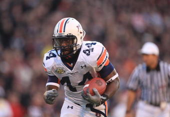 ATHENS - NOVEMBER 10:  Ben Tate #44 of the Auburn Tigers carries the ball during the NFL game against the Georgia Bulldogs at Sanford Stadium on November 10, 2007 in Athens, Georgia. (Photo by Streeter Lecka/Getty Images)