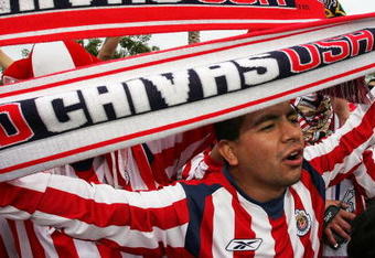 CARSON, CA - APRIL 23:  Chivas fans taunt Galaxy fans as they arrive to watch the CD Chivas USA take on the Los Angeles Galaxy in the inaugural Honda Super Clasico on April 23, 2005 at the Home Depot Center in Carson, California.  (Photo by Doug Benc/Getty Images)