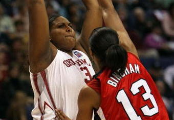 ST. LOUIS - APRIL 05:  Courtney Paris #3 of the Oklahoma Sooners looks to pass as Candyce Bingham #13 of the Louisville Cardinals defends during the Women's Final Four Semifinals on April 5, 2009 at the Scottrade Center in St. Louis, Missouri.  (Photo by Elsa/Getty Images)