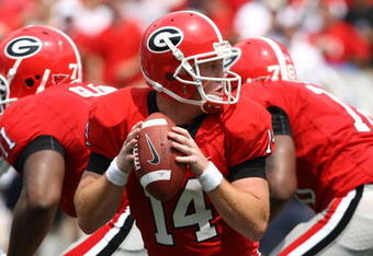 ATHENS, GA - AUGUST 30:  Quarterback Joe Cox #14 of the Georgia Bulldogs takes a snap and looks to hand the ball off during the game against the Georgia Southern Eagles at Sanford Stadium on August 30, 2008 in Athens, Georgia.  The Bulldogs defeated the Eagles 45-21.  (Photo by Mike Zarrilli/Getty Images)
