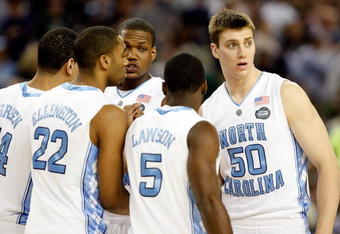 DETROIT - APRIL 04:  (R-L) Tyler Hansbrough #50, Ty Lawson #5, Deon Thompson #21, Wayne Ellington #22 and Danny Green #14 of the North Carolina Tar Heels huddle while taking on the Villanova Wildcats during the National Semifinal game of the NCAA Division I Men's Basketball Championship at Ford Field on April 4, 2009 in Detroit, Michigan.  (Photo by Streeter Lecka/Getty Images)