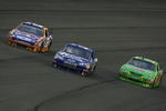 FONTANA, CA - FEBRUARY 22:  Jamie McMurray (L), driver of the #26 Crown Royal Ford, John Andretti (C), driver of the #34 WindowWorld.com Chevrolet, and Kyle Busch (R), driver of the #18 Interstate Batteries Toyota, drive during the NASCAR Sprint Cup Series Auto Club 500 at Auto Club Speedway on February 22, 2009 in Fontana, California.  (Photo by Jeff Gross/Getty Images)