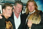NEW YORK - MARCH 11:  (L-R) Wrestler Eddie Guerrero, WWE Chairman Vince McMahon and Wrestler Triple H attend a press conference to promote Wrestlemania XX at Planet Hollywood March 11, 2004 in New York City.  (Photo by Peter Kramer/Getty Images)