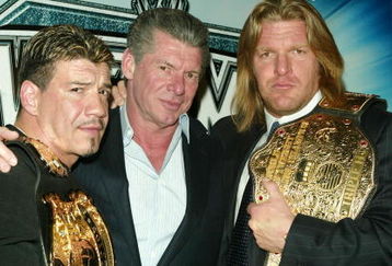 NEW YORK - MARCH 11:  (L-R) Wrestler Eddie Guerrero, WWE Chairman Vince McMahon and Wrestler Triple H attend a press conference to promote Wrestlemania XX at Planet Hollywood March 11, 2004 in New York City.  (Photo by Peter Kramer/Getty Images)
