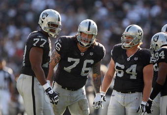 OAKLAND, CA - NOVEMBER 2:  (L-R) Offensive Linemen Kwame Harris #77, Robert Gallery #76 and Jake Grove #64 of the Oakland Raiders look on during a break in play against the Atlanta Falcons on November 2, 2008 at the Oakland-Alameda County Coliseum in Oakland, California. The Falcons defeated the Raiders 24-0. (Photo by Jed Jacobsohn/Getty Images)