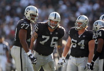OAKLAND, CA - NOVEMBER 2:  (L-R) Offensive Linemen Kwame Harris #77, Robert Gallery #76 and Jake Grove #64 of the Oakland Raiders look on during a break in play against the Atlanta Falcons on November 2, 2008 at the Oakland-Alameda County Coliseum in Oakland, California. The Falcons defeated the Raiders 24-0. (Photo by Jed Jacobsohn/Getty Images)