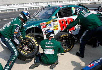 DOVER, DE - JUNE 01:  The crew for Dale Earnhardt Jr., driver of the #88 AMP/National Guard Chevrolet performs service during the NASCAR Sprint Cup Series Best Buy 400 at Dover International Speedway on June 1, 2008 in Dover, Delaware.  (Photo by Geoff Burke/Getty Images for NASCAR)