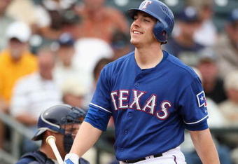 SURPRISE, AZ - MARCH 05:  Taylor Teagarden #2 of the Texas Rangers reacts after striking out during the spring training game against the San Diego Padres at Surprise Stadium on March 5, 2009 in Surprise, Arizona. The Rangers defeated the Padres 4-3.  (Photo by Christian Petersen/Getty Images)