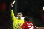 LIVERPOOL, UNITED KINGDOM - MARCH 10:  Referee Frank De Bleeckere shows a yellow card to Javier Mascherano of Liverpool during the UEFA Champions League Round of Sixteen, Second Leg match between Liverpool and Real Madrid at Anfield on March 10, 2009 in Liverpool, England. (Photo by Clive Mason/Getty Images)
