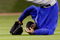 HOUSTON - APRIL 06:  Milton Bradley #21 of the Chicago Cubs flips over after missing a fly ball against the Houston Astros on Opening Day on April 6, 2009 at Minute Maid Park in Houston, Texas.  The Cubs defeated the Astros 4-2.  (Photo by Chris Graythen/Getty Images)