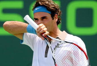 KEY BISCAYNE, FL - APRIL 03:  Roger Federer of Switzerland wipes his face while playing against Novak Djokovic of Serbia during the men's semifinal of the Sony Ericsson Open at the Crandon Park Tennis Center on April 3, 2009 in Key Biscayne, Florida.  (Photo by Matthew Stockman/Getty Images)