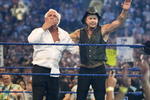 HOUSTON, TX - APRIL 5: (L-R) Actor Mickey Rourke celebrates with Ric Flair after beating WWE Superstar Chris Jericho during WrestleMania 25 at Reliant Stadium on April 5, 2009 in Houston, Texas.  (Photo by Bill Olive/Getty Images)
