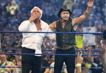 HOUSTON, TX - APRIL 5: (L-R) Actor Mickey Rourke celebrates with Ric Flair after beating WWE Superstar Chris Jericho during WrestleMania 25 at Reliant Stadium on April 5, 2009 in Houston, Texas.  (Photo by Bill Olive/Getty Images)