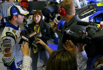 FORT WORTH, TX - APRIL 15:  Jimmie Johnson, driver of the #48 Lowe's Chevrolet, speaks with members of the media after crashing during the NASCAR Nextel Cup Series Samsung 500 at Texas Motor Speedway on April 15, 2007 in Fort Worth, Texas.  (Photo by Rusty Jarrett/Getty Images for NASCAR)
