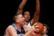 NEW YORK - DECEMBER 23: Greg Ostertag #00 of the Utah Jazz tries to shoot over Channing Frye #7 of the New York Knicks on December 23, 2005 at Madison Square Garden in New York City. NOTE TO USER: User expressly acknowledges and agrees that, by downloading and or using this photograph, User is consenting to the terms and conditions of the Getty Images License Agreement. (Photo by Ezra Shaw/Getty Images)