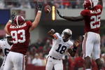 TUSCALOOSA, AL - NOVEMBER 29:  Quarterback Kodi Burns #18 of the Auburn Tigers has a pass tipped by defensive lineman Bobby Greenwood #93 and linebacker Rolando McClain #25 of the Alabama Crimson Tide at Bryant-Denny Stadium on November 29, 2008 in Tuscaloosa, Alabama.  (Photo by Doug Benc/Getty Images)