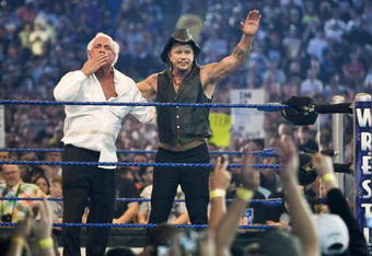 HOUSTON, TX - APRIL 5: (L-R) Actor Mickey Rourke celebrates with Ric Flair after beating WWE Superstar Chris Jericho during WrestleMania 25 at Reliant Stadium on April 5, 2009 in Houston, Texas.  (Photo by Bill Olive/Getty Images)